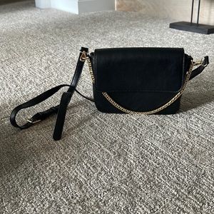 Black structured bag with gold chain handle